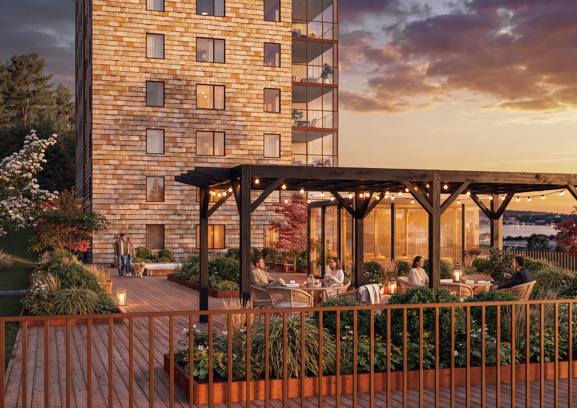 Gemensam terrass med pergola och uterum i kvällsljus